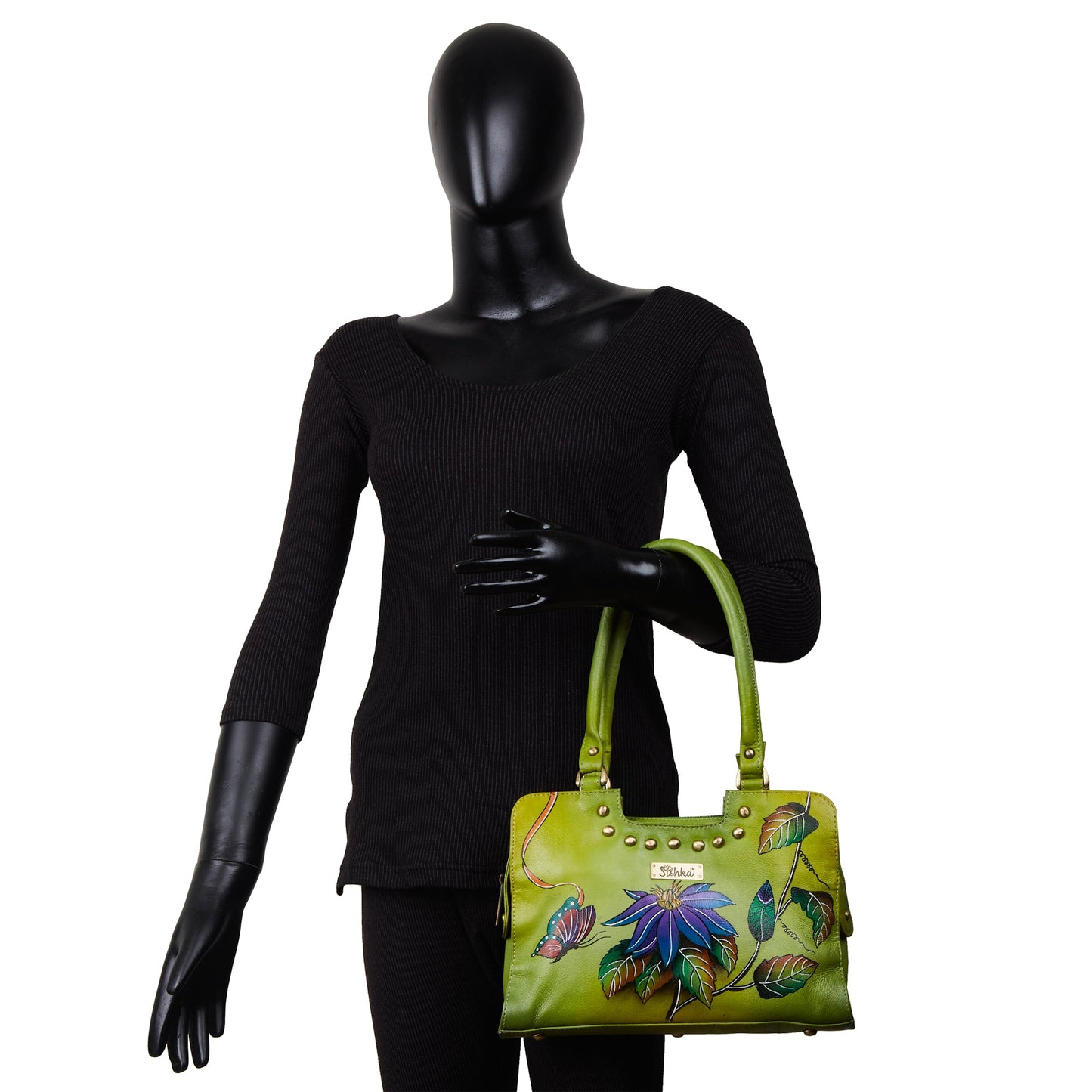 Emerald green floral design hand-painted on a stylish leather bag