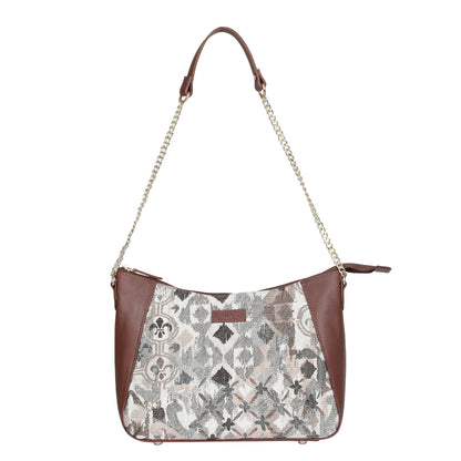 Women's abstract tapestry hobo sling bag with genuine leather trim for shopping, travel, commuting, and everyday use